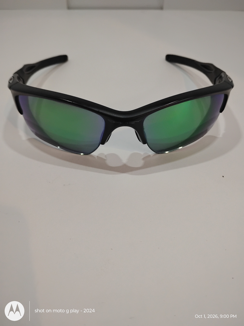 Oakley Black Frame Sunglasses with Green Mirrored Lenses